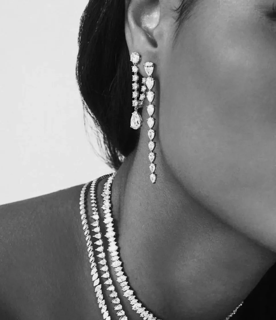 Custom designed earrings and necklaces, gold with diamonds
